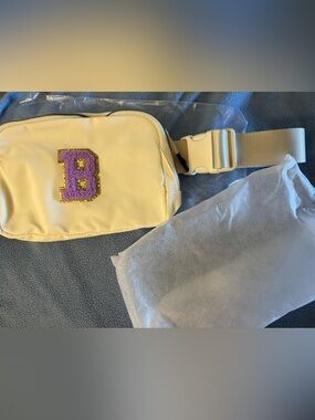 NIB- Unique Cream Crossbody Belt Bag with Purple 'B' Patch with dust bag